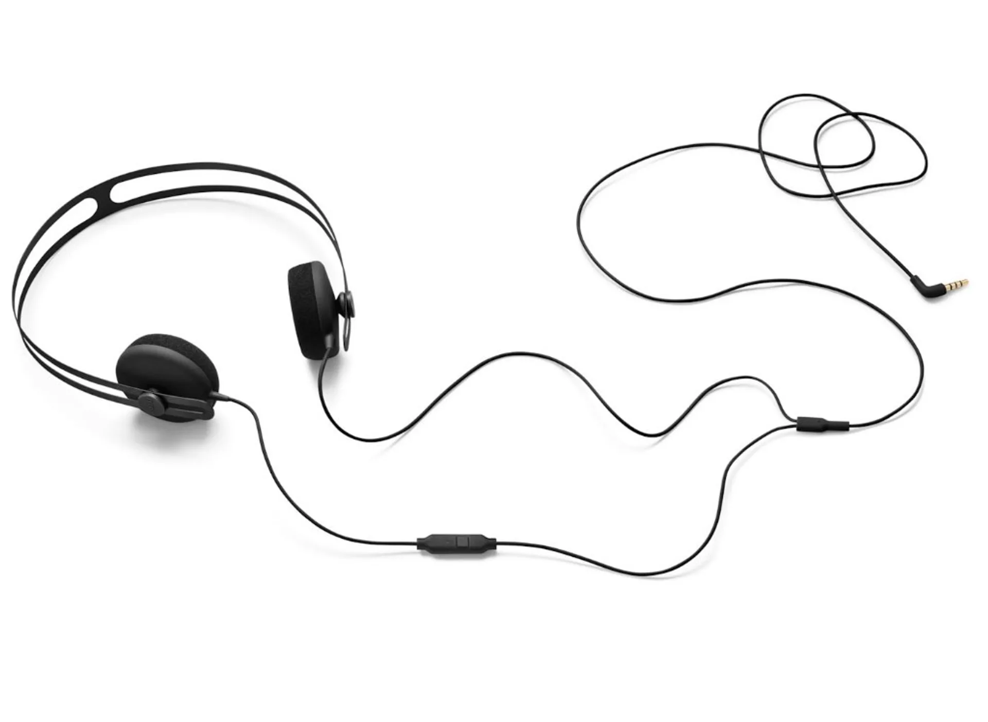 AIAIAI Tracks minimalist matte black on-ear wired headphones with inline mic remote and gold-tipped 3.5mm jack on white back…