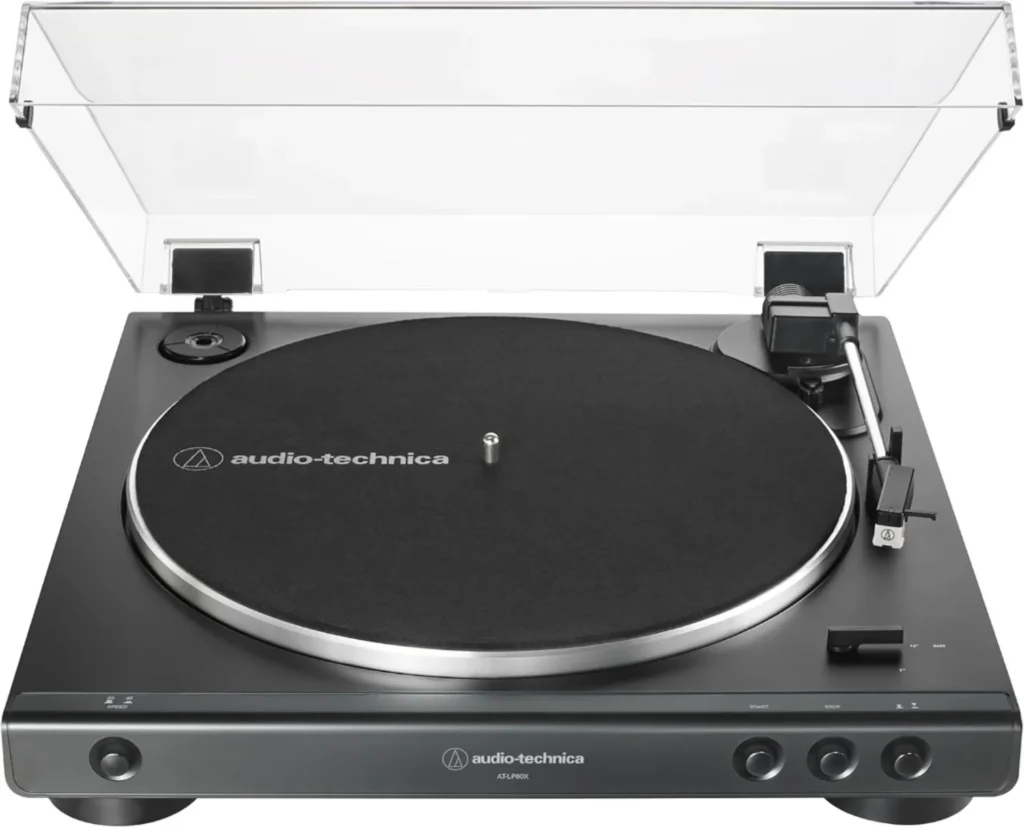 Front view of an Audio-Technica AT-LP60X fully automatic belt-drive turntable in matte black, dust cover open, showing platt…