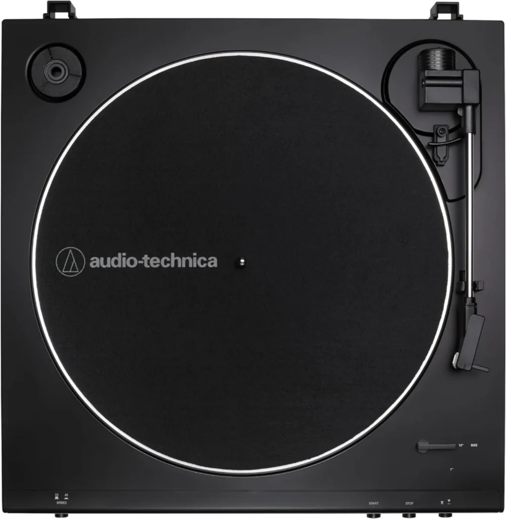 Top-down view of a black Audio-Technica AT-LP60X turntable showing platter, slipmat, tonearm, speed and size controls.