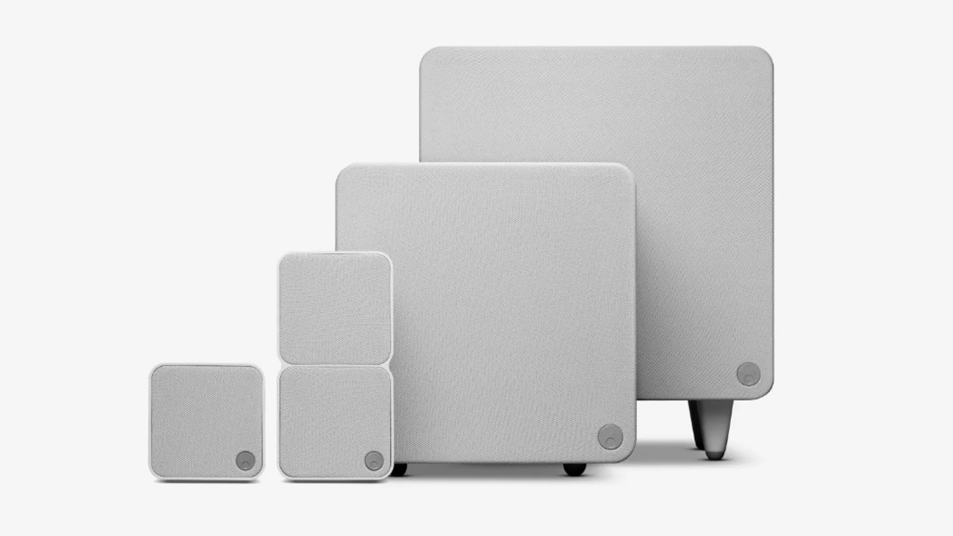 Cambridge Audio Minx system in light grey fabric finish: compact satellite, taller satellite, and two subwoofers with metal…