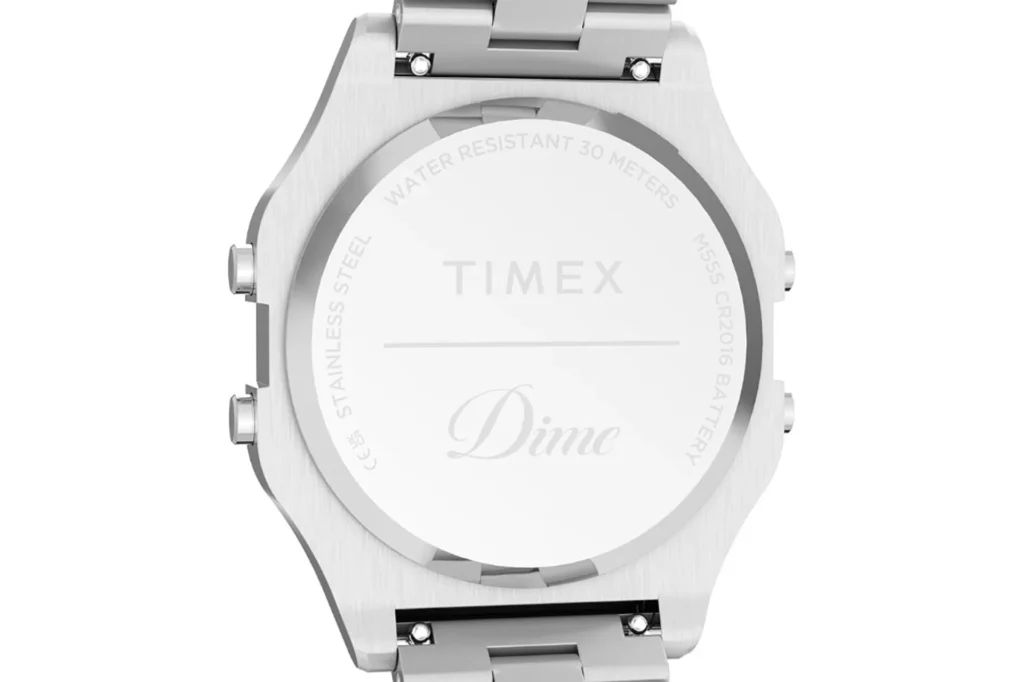 Close-up Dime x Timex T80 circular case back: Timex and Dime engravings, water resistant 30m, stainless steel and CR2016 bat…
