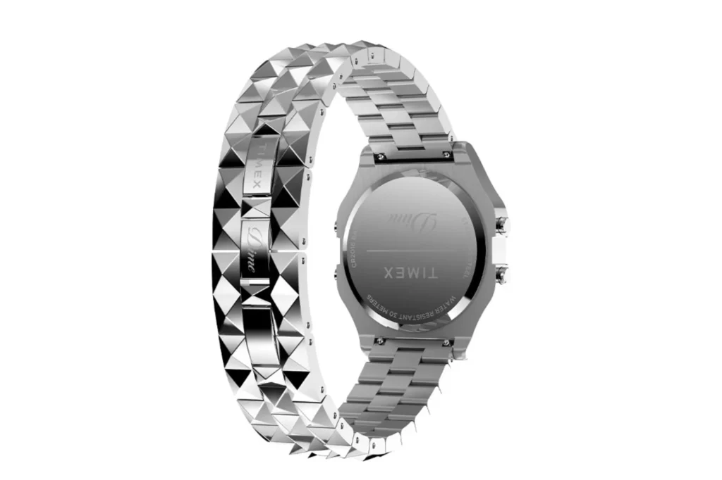 Dime x Timex T80 rear three-quarter angle: engraved case back with Dime and Timex logos, water resistant and battery text, r…