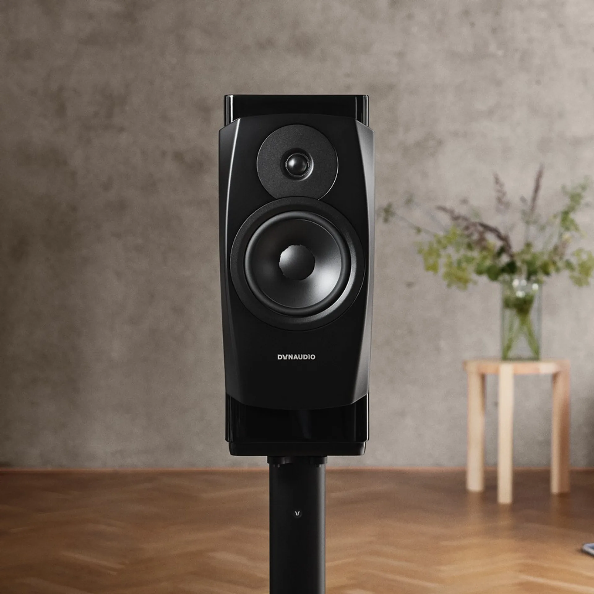 Front view of Dynaudio Confidence 20A on stand, highlighting driver layout and cabinet shape.