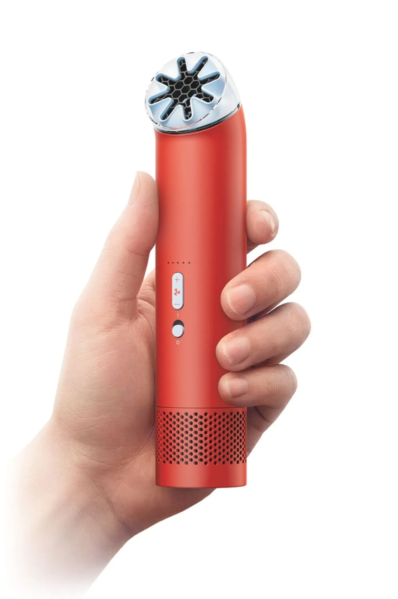 Dyson HushJet Mini Cool in Carnelian Sky red: hand holds cylindrical bladeless fan with star outlet, silver control strip, white studio background.