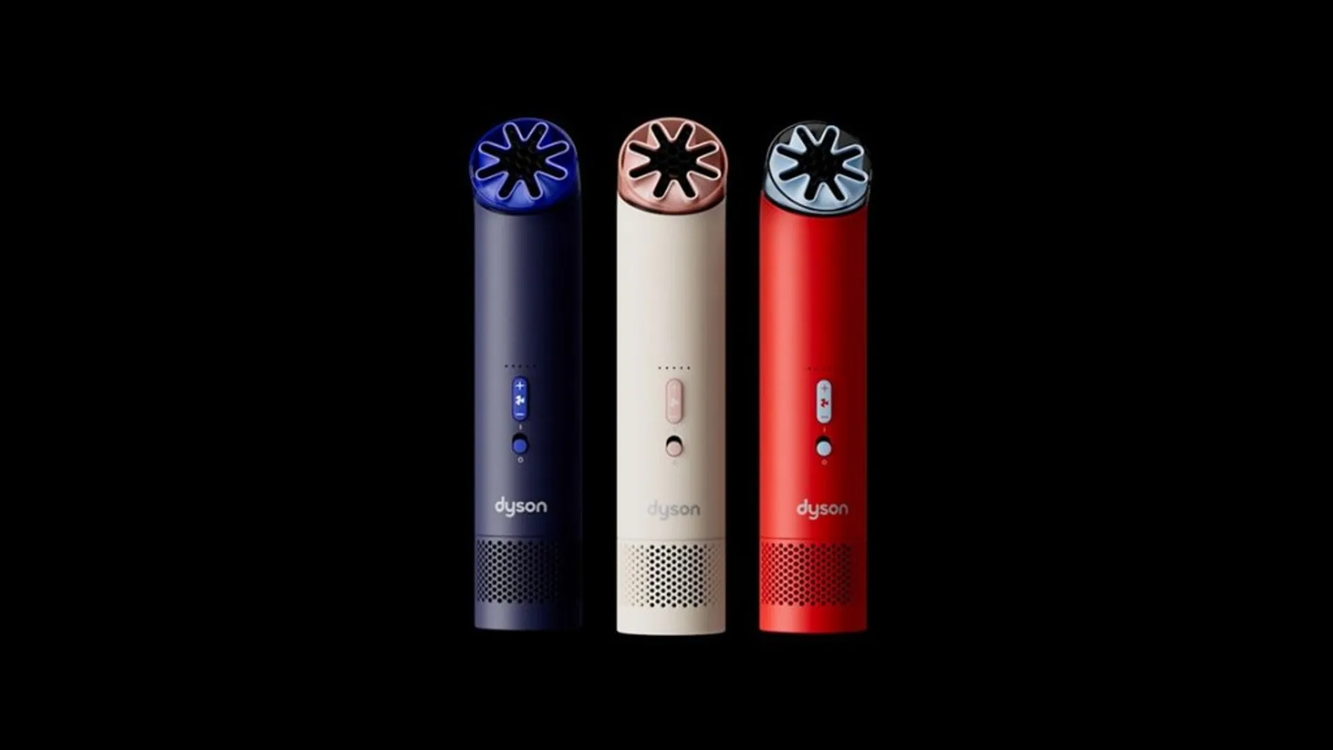 Three Dyson HushJet Mini Cool portable fans: navy blue, cream with rose gold nozzle, and red Carnelian Sky with pale nozzle on black background.