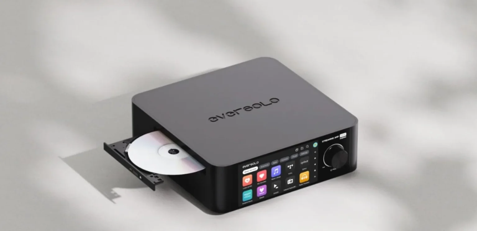 Eversolo all-in-one streaming amplifier with open CD tray, touchscreen Music Services menu and matte black finish on gray su…
