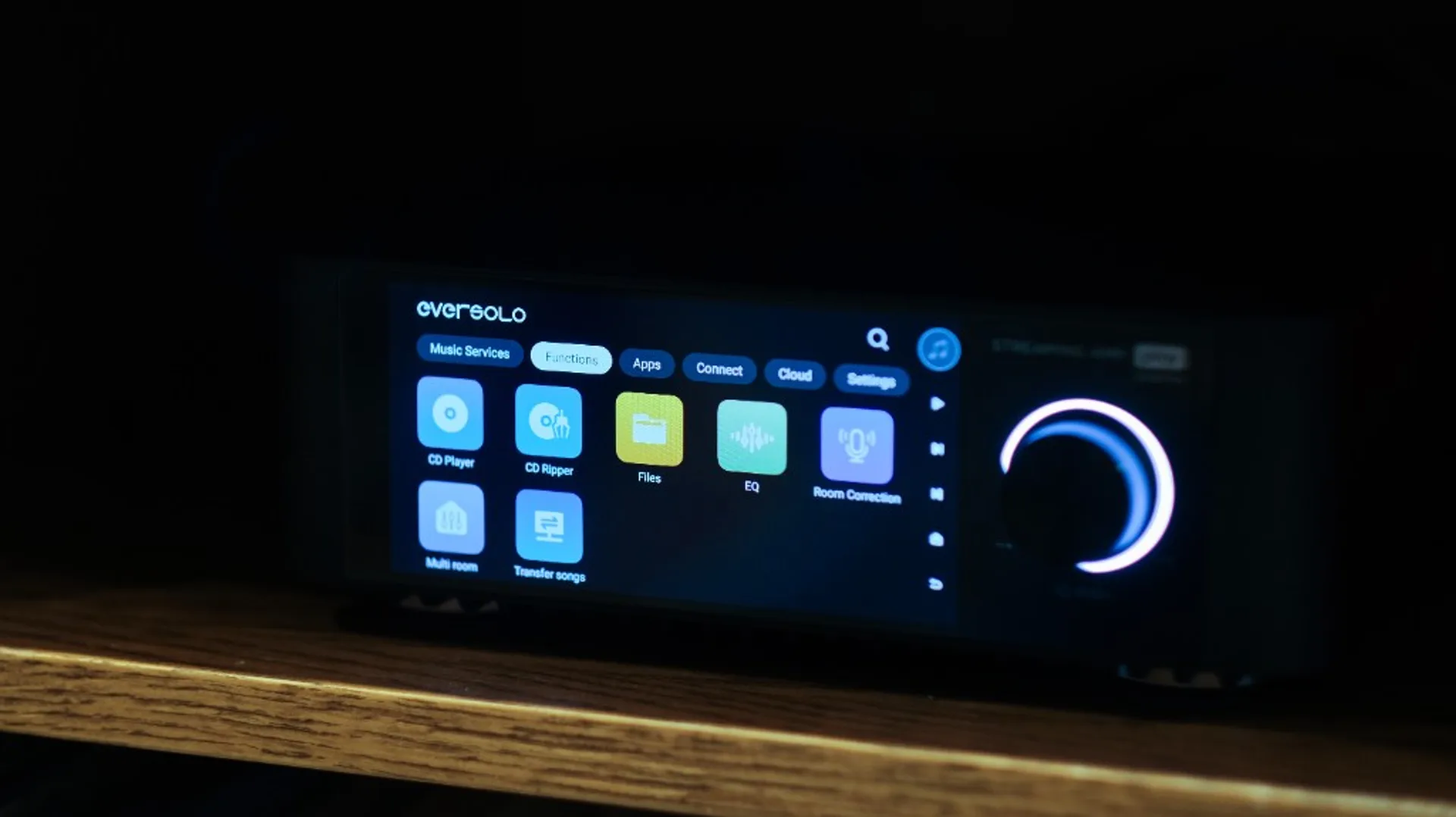 Eversolo streamer touchscreen on Functions tab with CD Player, CD Ripper, EQ and Room Correction icons next to a lit control…