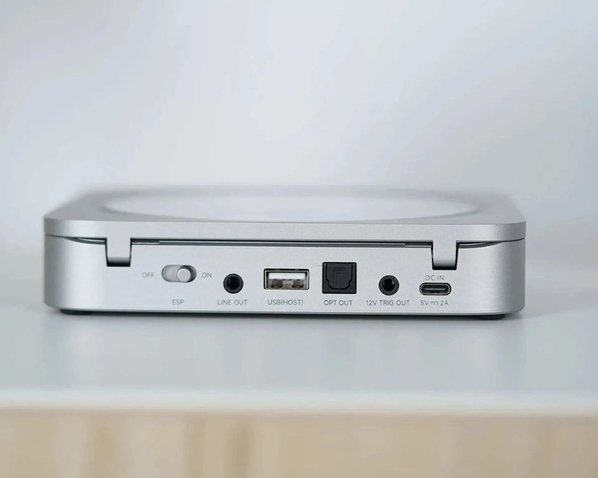 Rear panel of silver Fosi Audio Merak CD player: ESP switch, line out, USB host, optical out, 12V trigger, USB-C DC in 5V 2A…