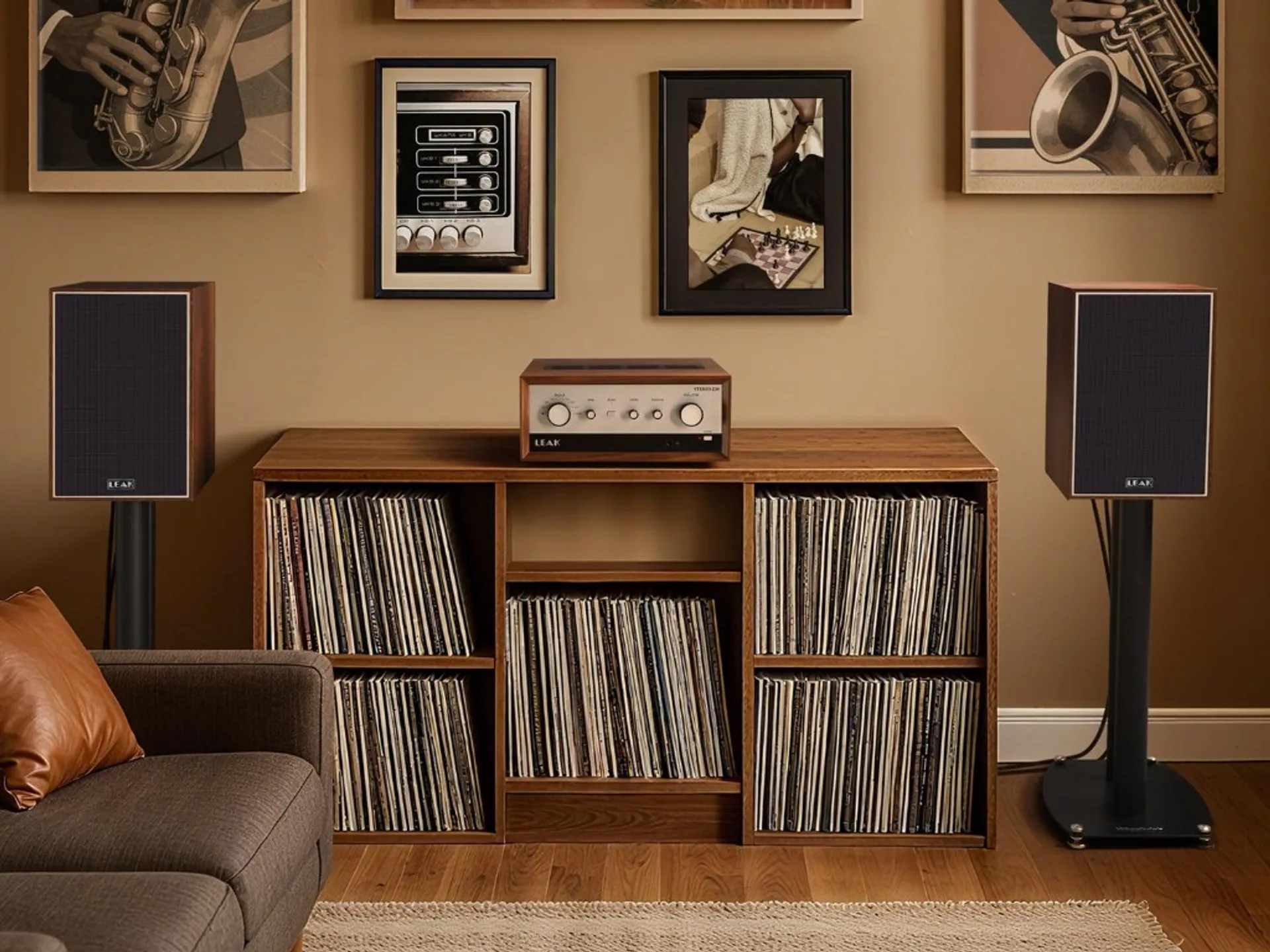 Leak Sandwich bookshelf speakers on stands with Leak Stereo 230 integrated amplifier on a wooden cabinet filled with vinyl r…