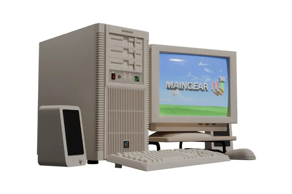 Retro Maingear desktop with beige tower, CRT monitor showing MAINGEAR 98 logo, keyboard, mouse, and speakers.