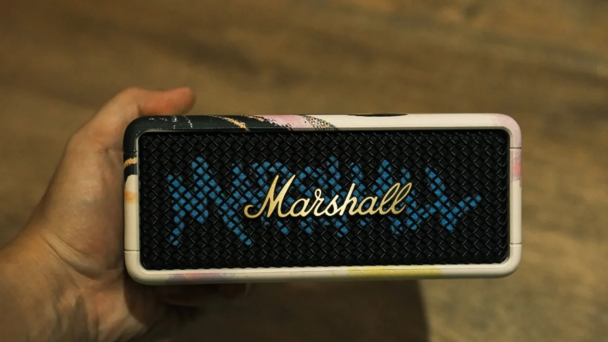 Marshall Emberton III Lunar New Year 2026 held in hand—portable Bluetooth speaker with Lunar New Year art frame and gold logo on grille.