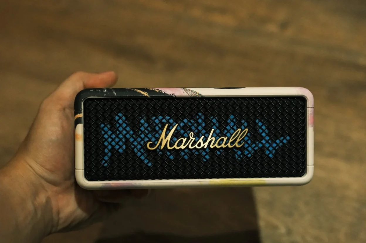 Marshall Emberton III Lunar New Year 2026 held in hand—portable Bluetooth speaker with Lunar New Year art frame and gold logo on grille.