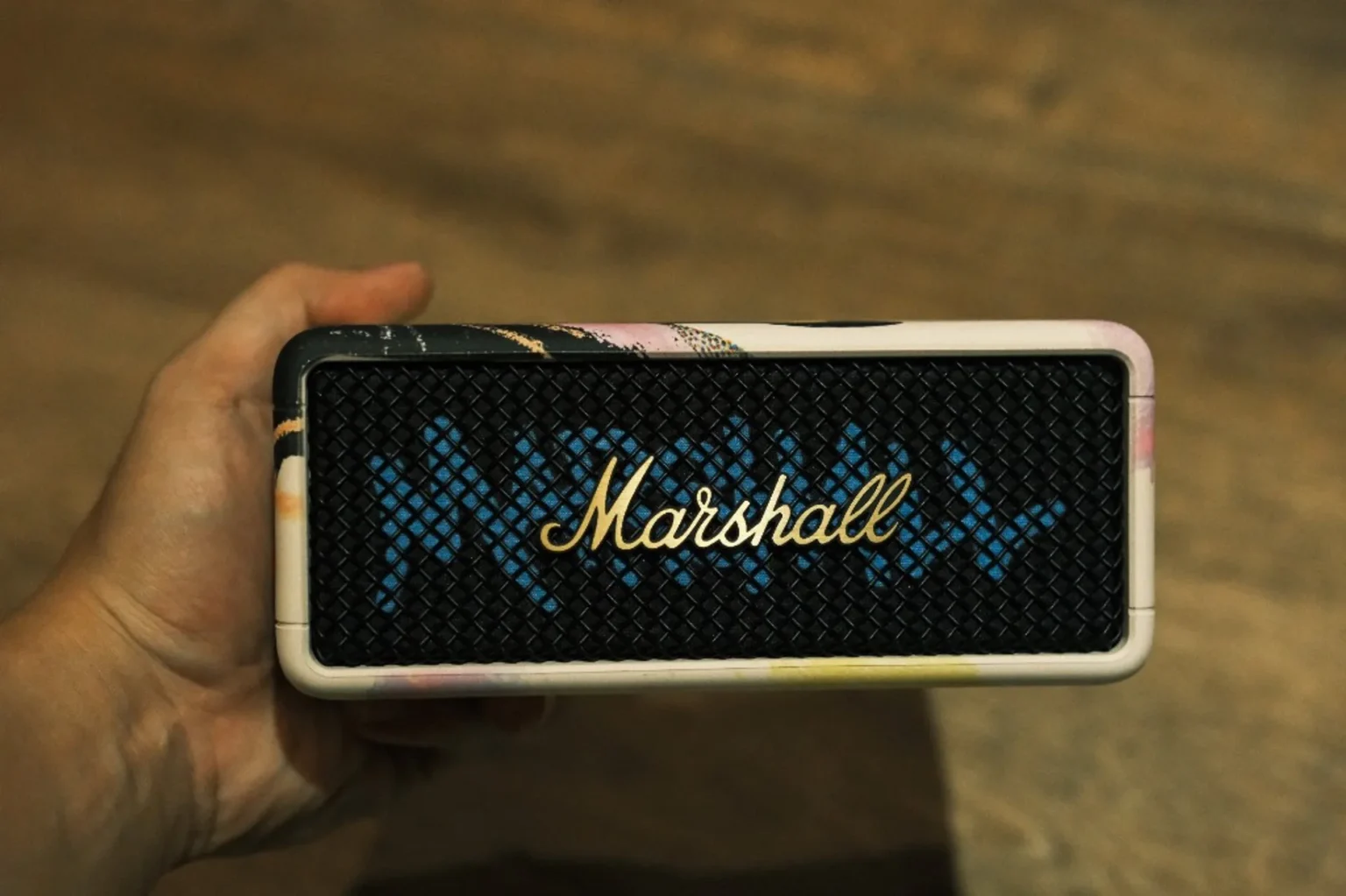 Marshall Emberton III Lunar New Year 2026 held in hand—portable Bluetooth speaker with Lunar New Year art frame and gold logo on grille.