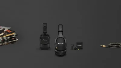 Marshall on-ear and over-ear headphones, true wireless earbuds and case on charcoal grey; vinyl stack left, coiled cable wit…
