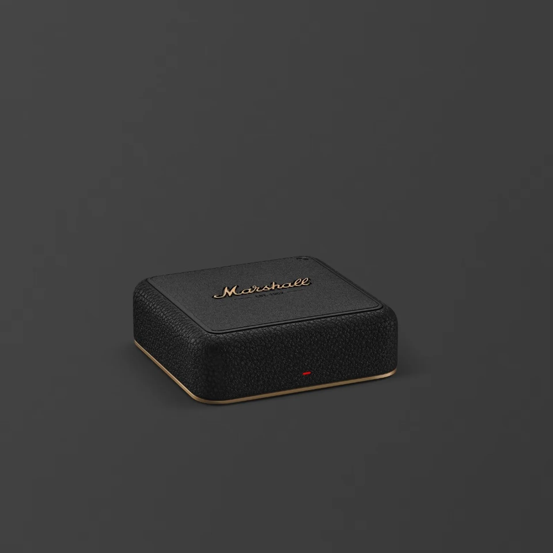 Compact square Marshall device with gold script logo and EST 1962, black pebbled sides, gold base trim, red LED on front, ch…