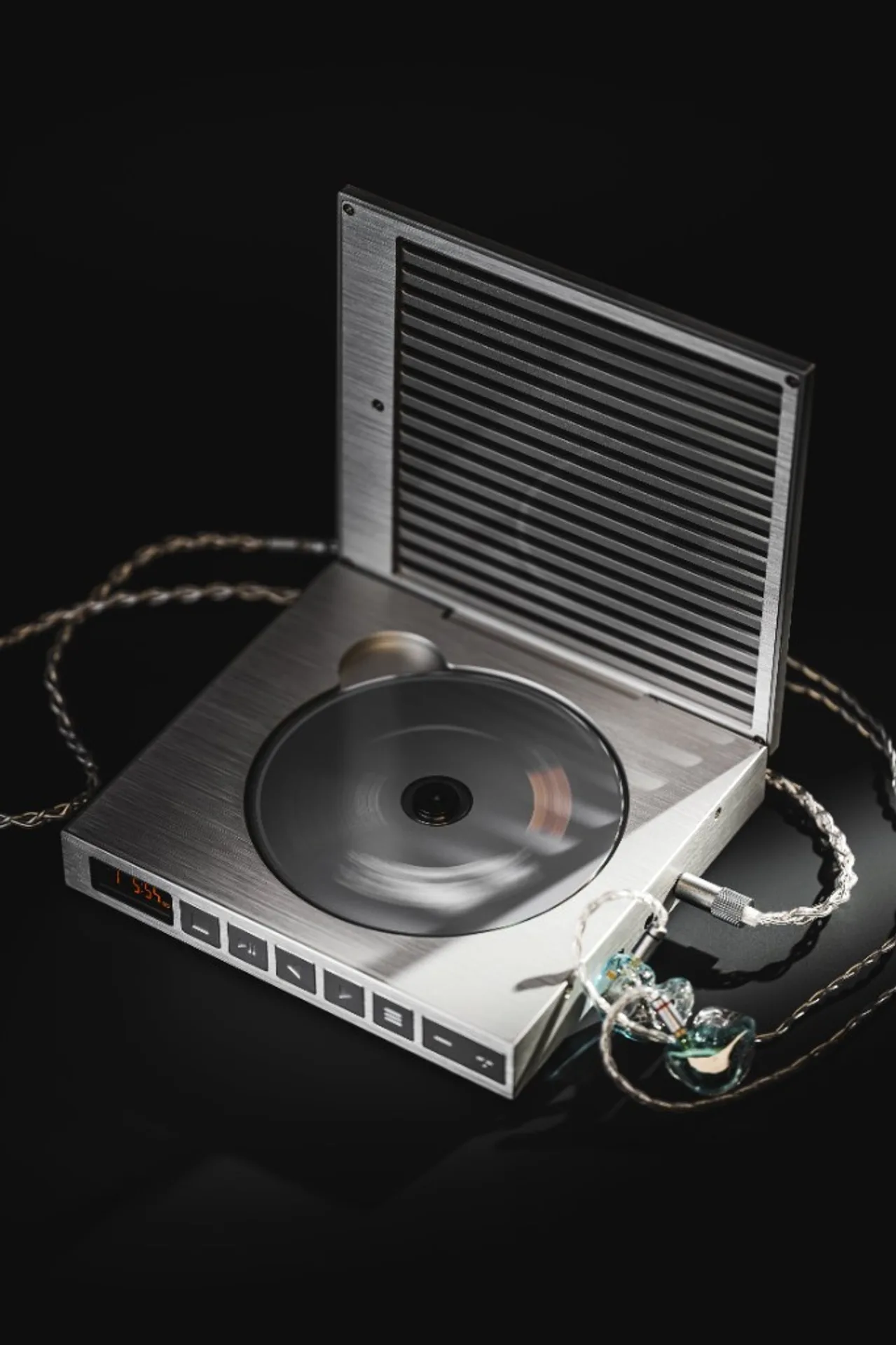 Moondrop DISCDREAM2 Ultra playing a CD with transparent IEMs connected, dramatic lighting on black.