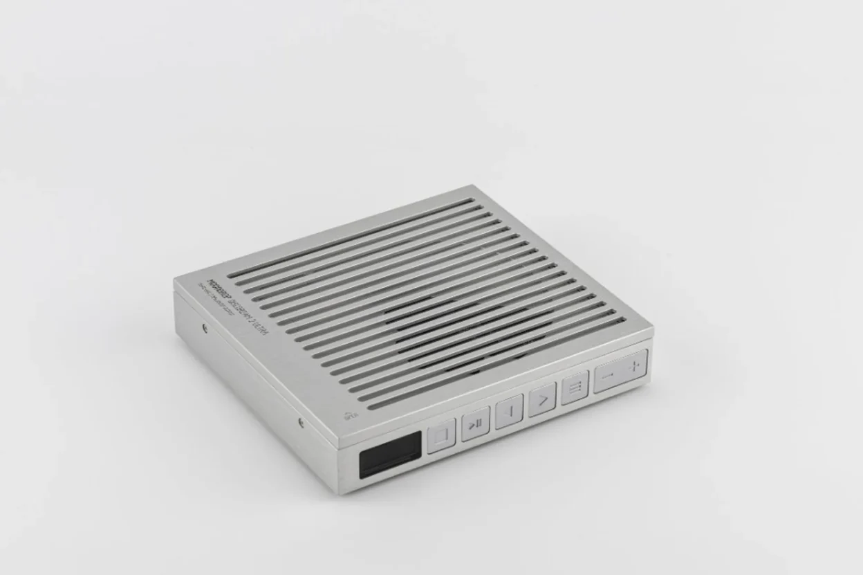 Moondrop DISCDREAM2 Ultra portable CD player three-quarter view on white background with top slats and front controls.