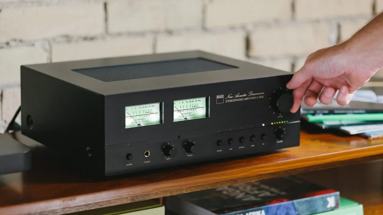 NAD C 3030 integrated amplifier VU meters hand on knob 2000x 313c6b62 7971 488f 948a 905adfa969a0