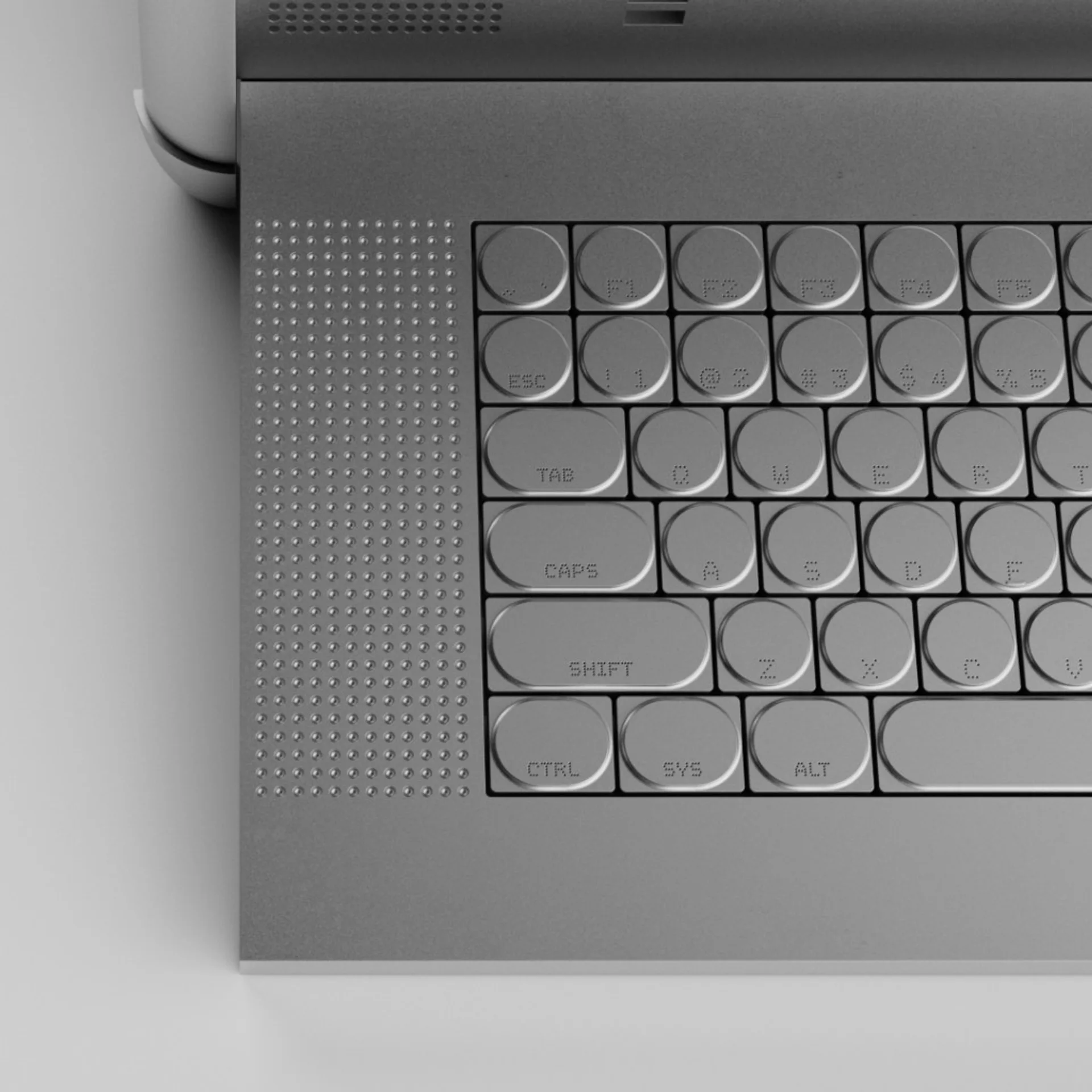 Top-down view of ODINN Omnia laptop keyboard with circular keys, pill-shaped modifiers, and textured grip grid in silver mon…