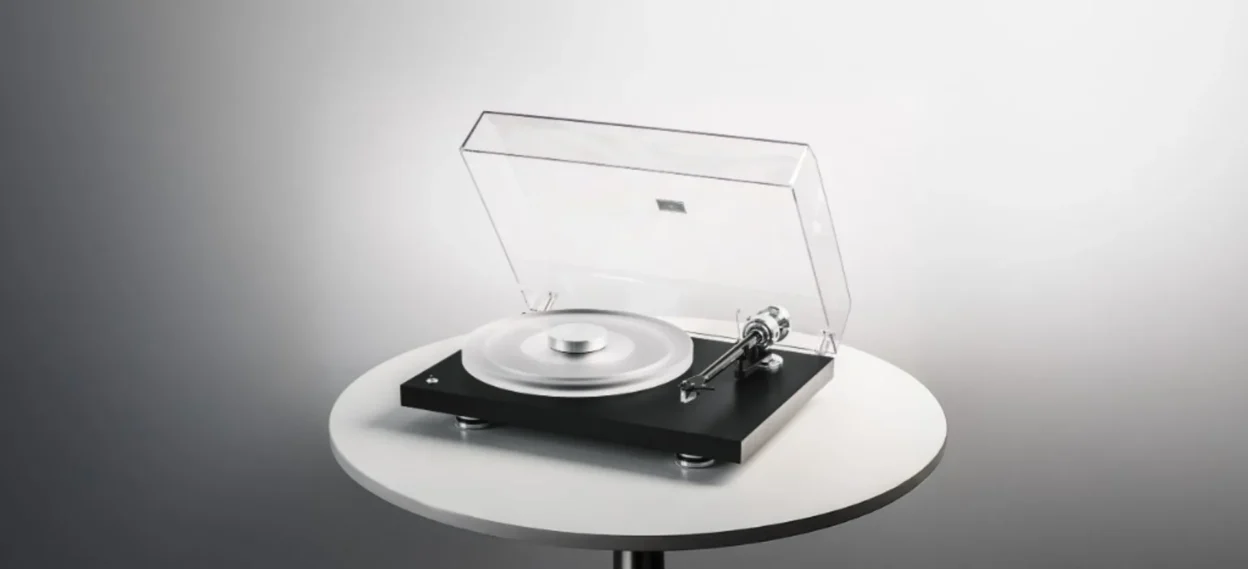 Pro-Ject Debut Reference 10 turntable with matte black plinth, frosted acrylic platter, silver record weight, clear dust cov…