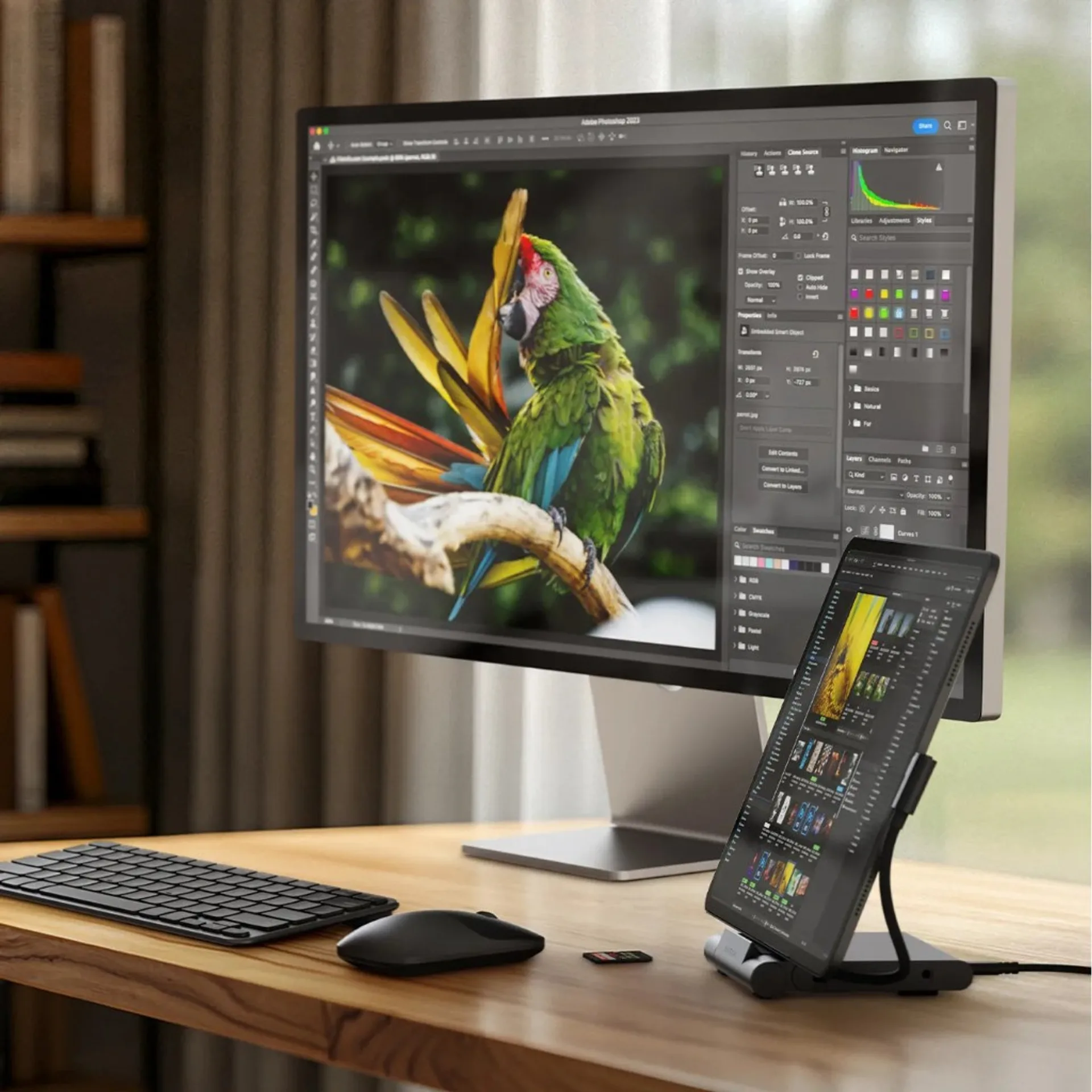 Desktop workstation scene with Satechi OntheGo Foldable Stand Hub holding a tablet as secondary screen next to a monitor.