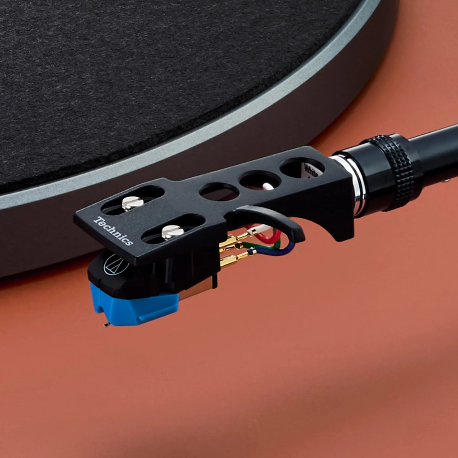 Close-up of Technics SL-50C headshell and preinstalled cartridge.