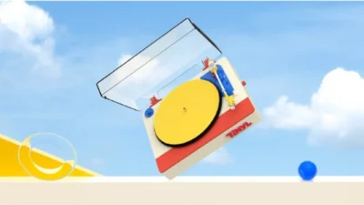 Tinyl Play Pro turntable in a surreal Memphis-style scene: cream, red, and yellow deck tilted against a bright blue sky with…