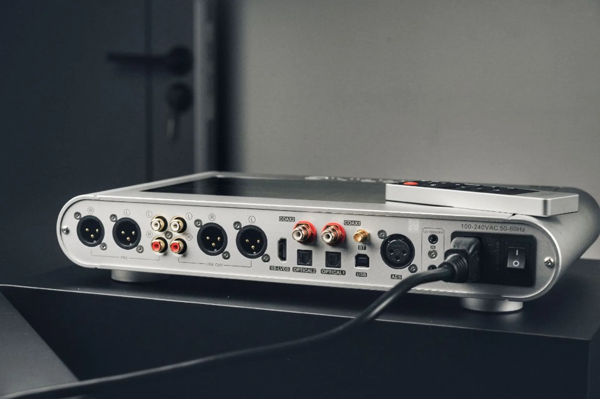 Rear I/O panel of Topping DX9 Discrete with XLR, RCA, USB, optical, coaxial, AES, and power input connections.