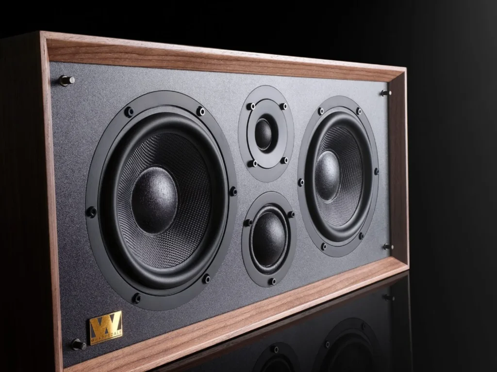 Wharfedale Heritage Centre three-quarter view: walnut cabinet, dark textured baffle with dual woofers, stacked tweeter and m…