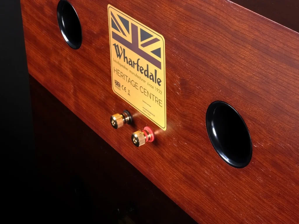 Rear of Wharfedale Heritage Centre: mahogany veneer, twin reflex ports, gold Heritage Centre plaque, and gold-plated binding…