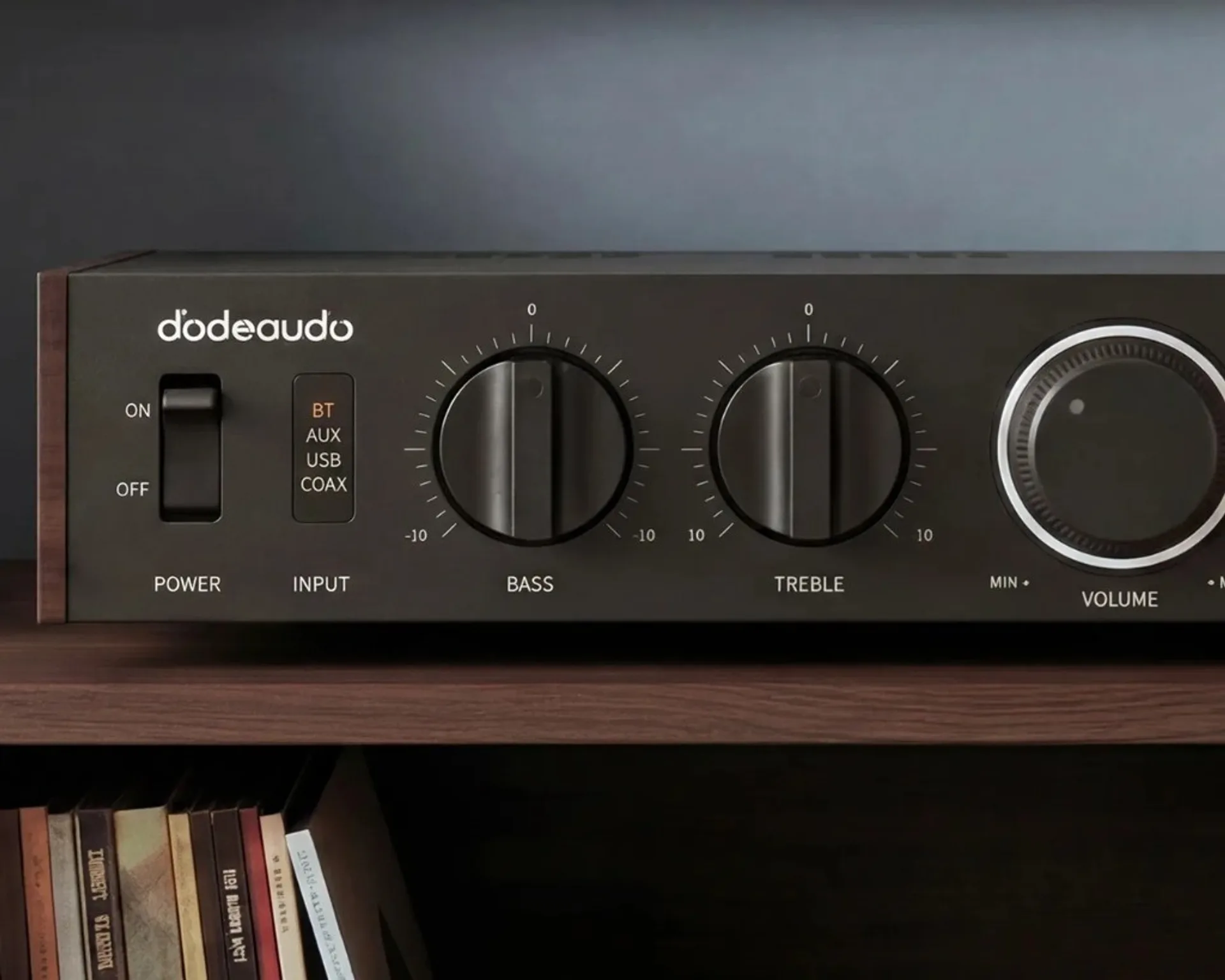 Close-up of FiiO Jade Audio Level 1 black walnut front panel with illuminated Bluetooth input indicator, bass, treble, and volume knobs.