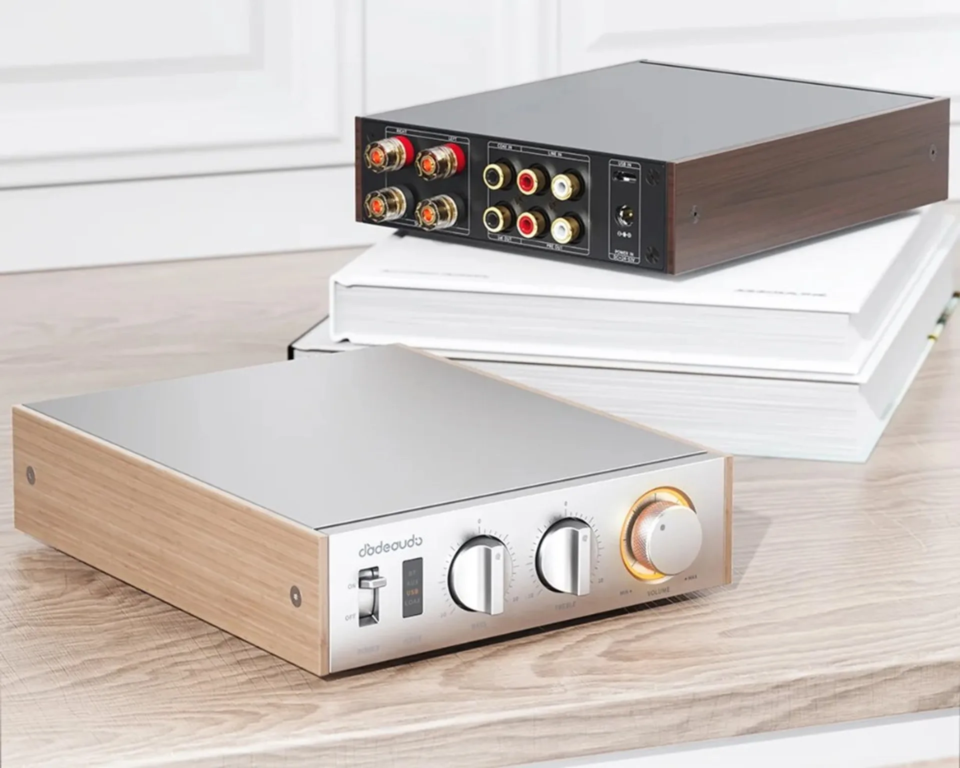 Two FiiO Jade Audio Level 1 amplifiers showing silver maple front panel and black walnut rear connectivity in light and dark wood finishes.