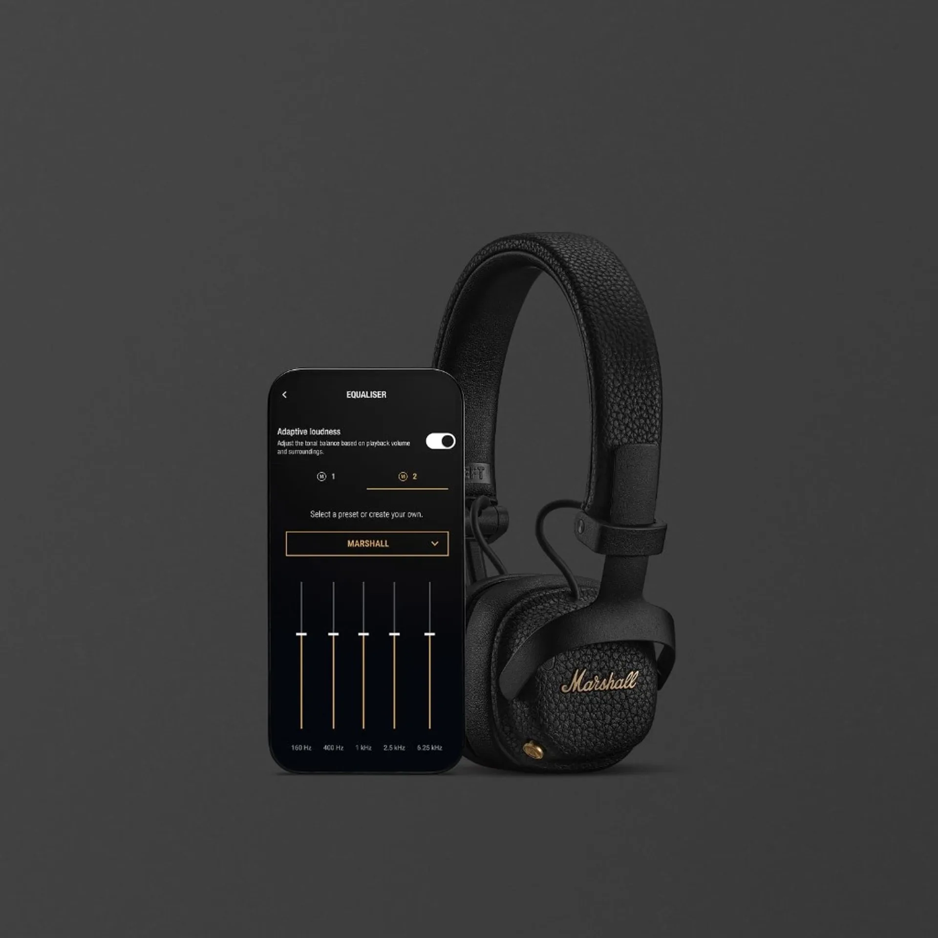 Marshall Milton ANC headphones beside smartphone showing Marshall Bluetooth app equalizer screen with adaptive loudness toggle and five-band EQ sliders.