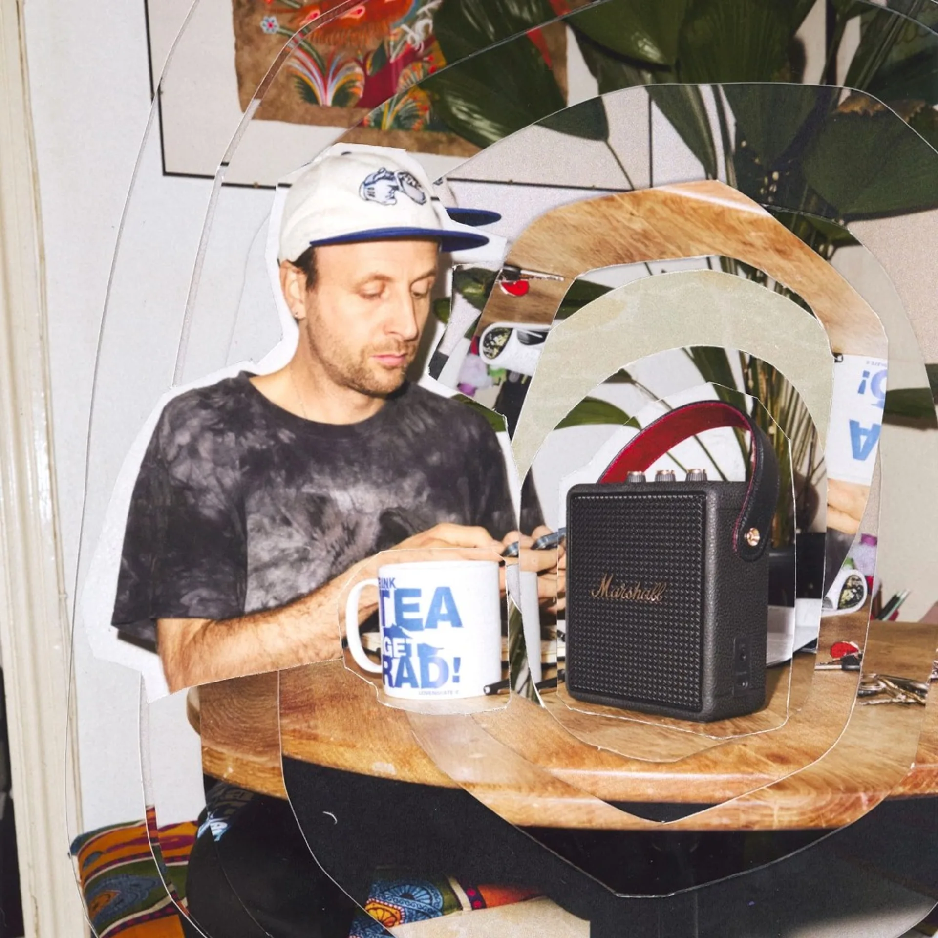 Marshall Stockwell III on a wooden desk in a creative collage lifestyle scene with a person and tea mug.