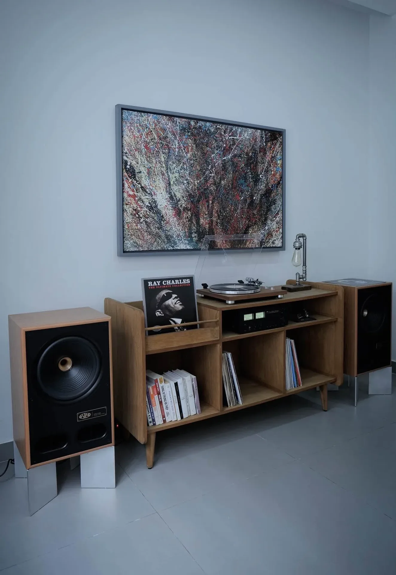 Pair of Vestlyd V12C speakers with TEAC turntable and NAD amplifier in vinyl listening corner